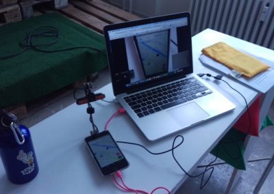 UX designer gets ready to usability test a mobile app using a device mounted camera - Mr. Tappy